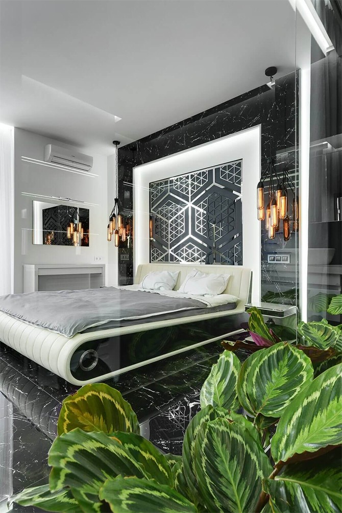 Комфортний сон Інтер'єр квартири 75 кв. м: зручне ліжко у спальні з сучасним дизайном