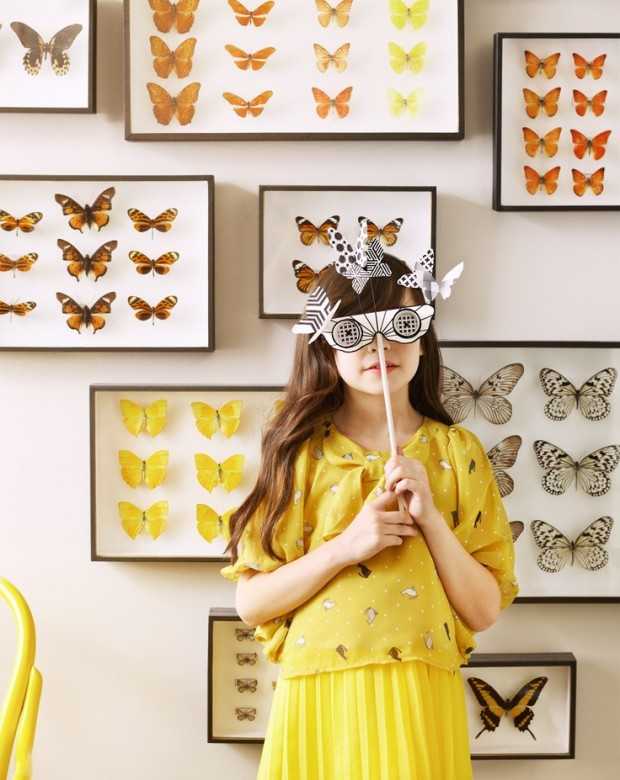 Метелики: барвистий акцент Яскравий декор стіни: різнокольорові метелики прикрашають інтер'єр, додаючи легкості та свіжості.