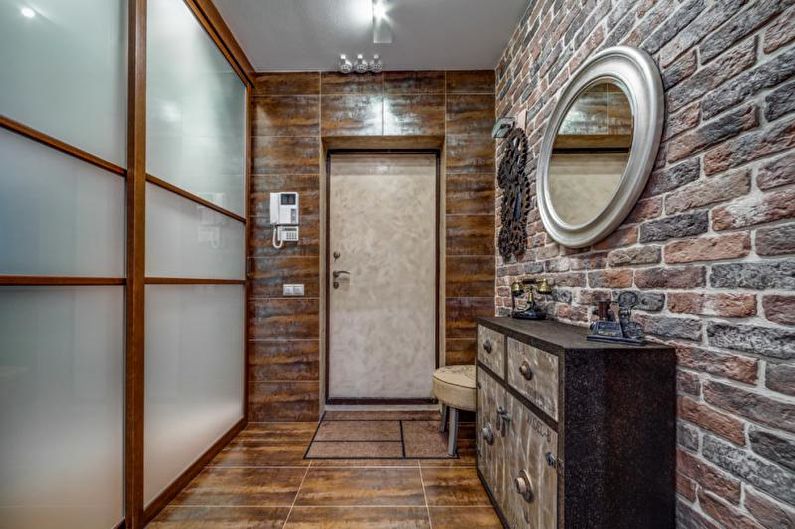 Еко-стиль у прихожій Планування квартири: використання екологічних матеріалів, таких як цегла, у передпокої.