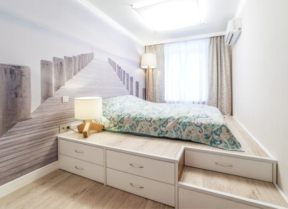 Ліжко-подіум: Зберігання і сон Ліжко-подіум з місцем для сну зверху та ящиками внизу: ідеальне рішення для зберігання речей.