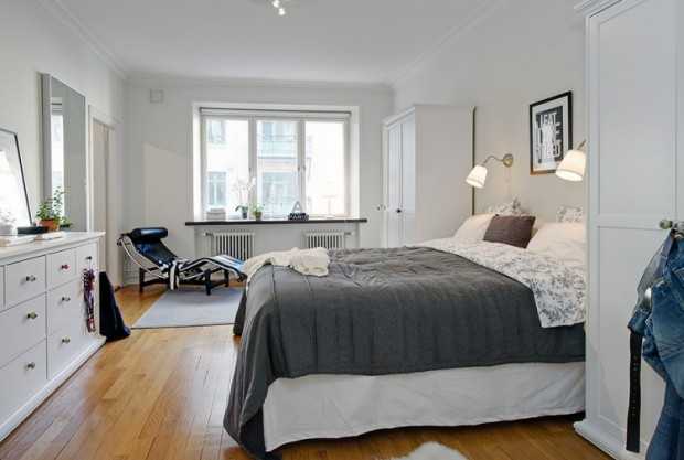 Дитяча кімната мрії Біло-рожева дитяча кімната з дерев'яними іграшками та меблями в скандинавському стилі.